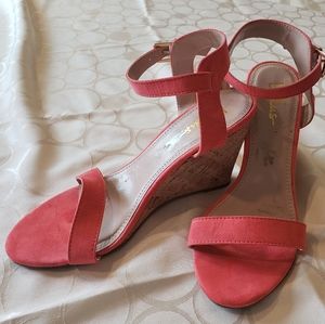Coral color wedge heel sandals.